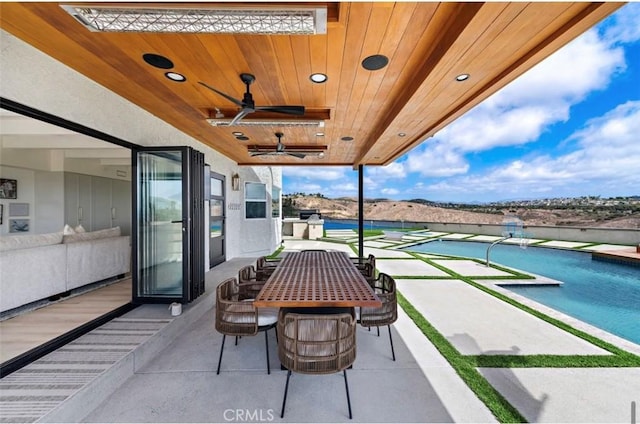 view of patio with ceiling fan