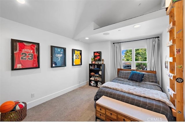 bedroom featuring lofted ceiling and carpet