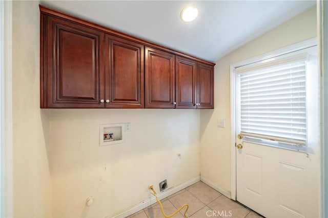 laundry area featuring washer hookup, hookup for a gas dryer, cabinets, and light tile patterned flooring