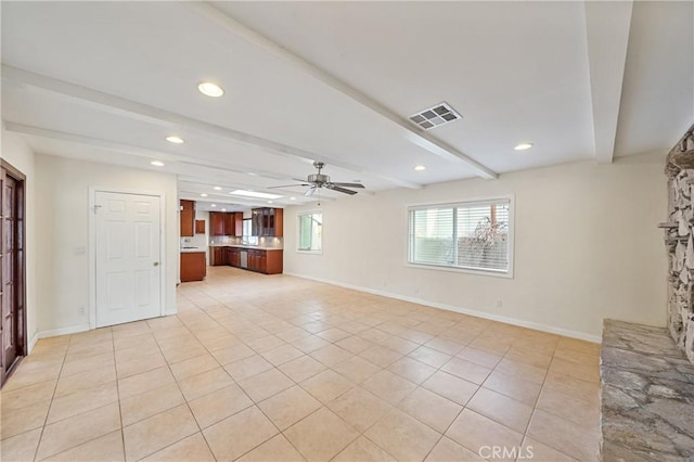 unfurnished living room featuring beamed ceiling, ceiling fan, a stone fireplace, and light tile patterned floors