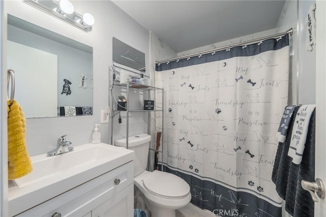 bathroom with vanity, toilet, and a shower with shower curtain