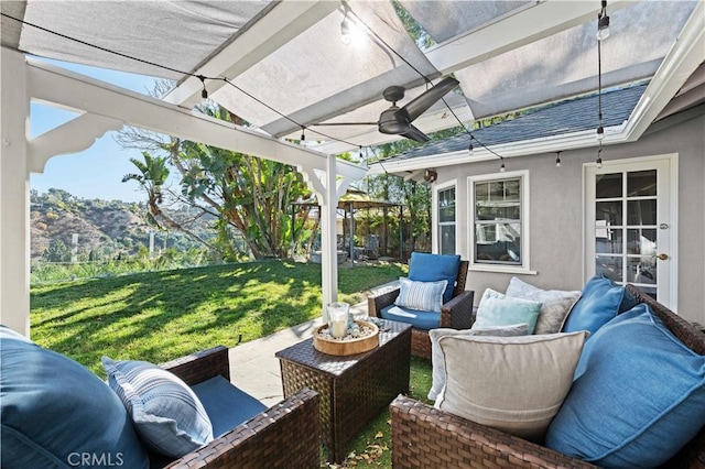 view of patio / terrace featuring a mountain view, a pergola, and an outdoor hangout area