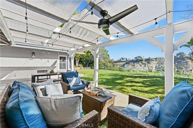 view of patio / terrace featuring an outdoor living space, ceiling fan, and a pergola