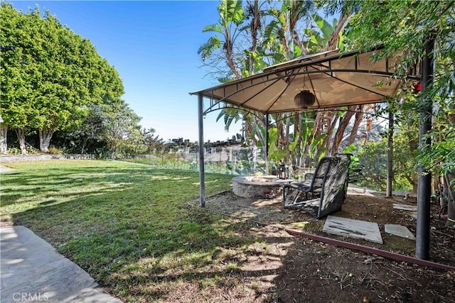 view of yard with a gazebo and an outdoor fire pit