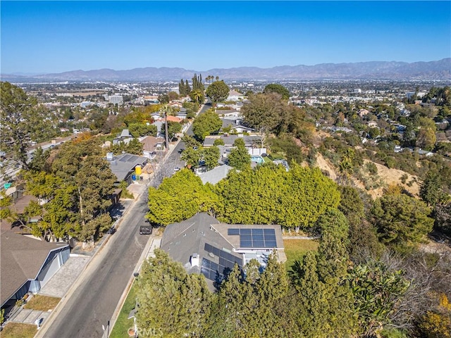 birds eye view of property featuring a mountain view