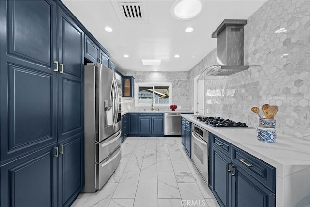 kitchen featuring sink, stainless steel appliances, light stone counters, decorative backsplash, and wall chimney exhaust hood