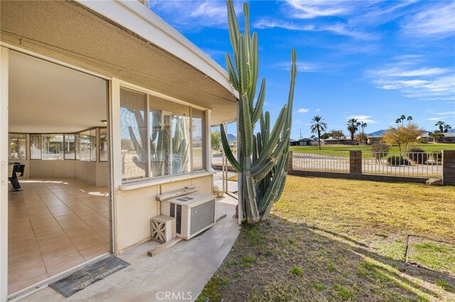 exterior space featuring a lawn and a patio area