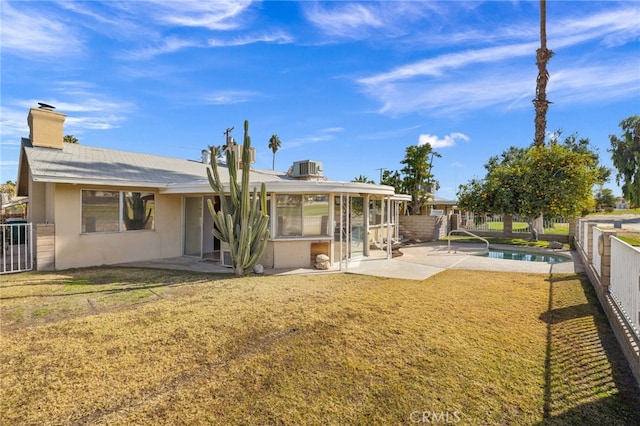 back of property with a fenced backyard, a patio, and stucco siding