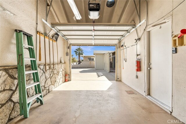 garage featuring a garage door opener