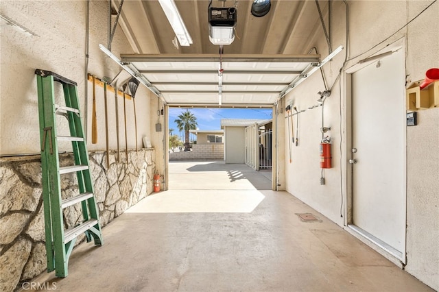 garage featuring a garage door opener
