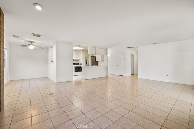 unfurnished living room featuring visible vents, a ceiling fan, and light tile patterned floors