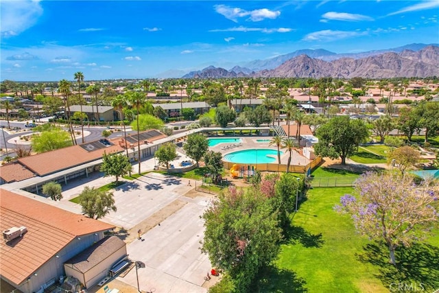 drone / aerial view featuring a residential view and a mountain view