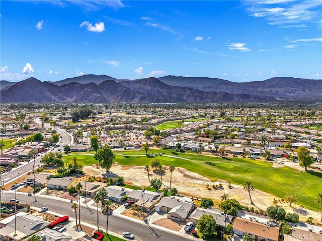 birds eye view of property featuring a mountain view, golf course view, and a residential view