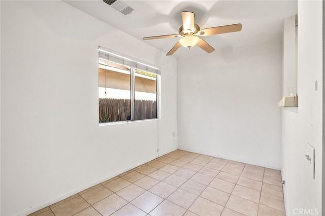 spare room with visible vents, a ceiling fan, and light tile patterned flooring