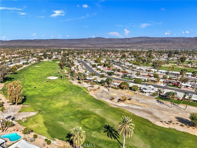 aerial view with a residential view, a mountain view, and golf course view