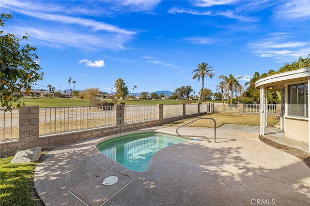 view of pool featuring a fenced backyard, a pool, a mountain view, and a patio area