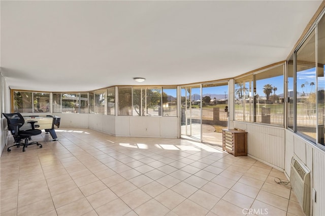 unfurnished sunroom with tile patterned flooring