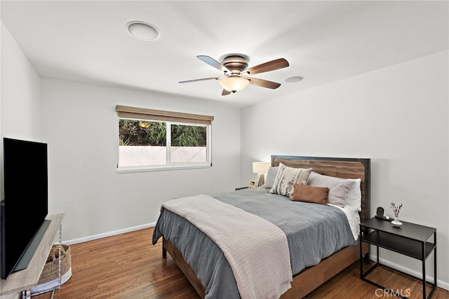 bedroom featuring ceiling fan and hardwood / wood-style floors