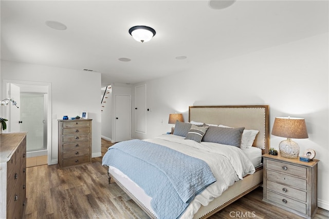 bedroom featuring dark hardwood / wood-style flooring