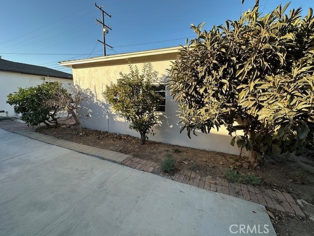 view of side of property featuring a patio