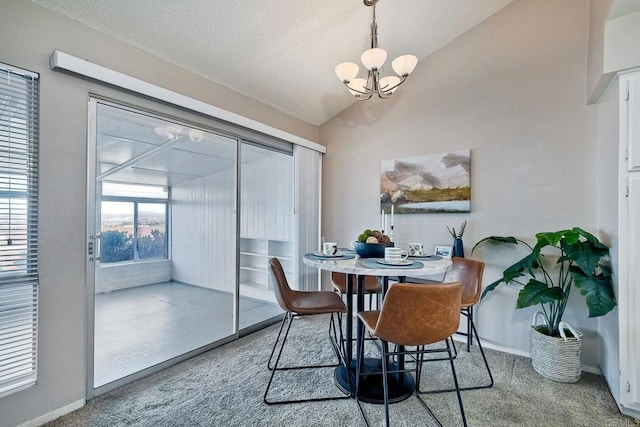 carpeted dining room featuring vaulted ceiling and an inviting chandelier