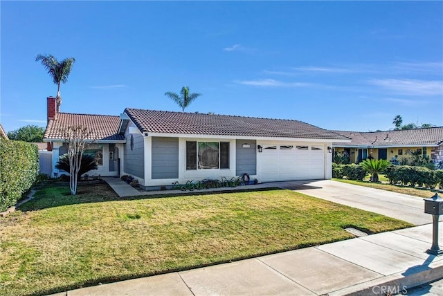 ranch-style house featuring a garage and a front lawn