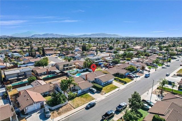 birds eye view of property featuring a mountain view