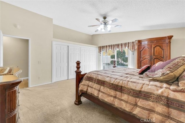 bedroom with lofted ceiling, light carpet, access to outside, a textured ceiling, and ceiling fan