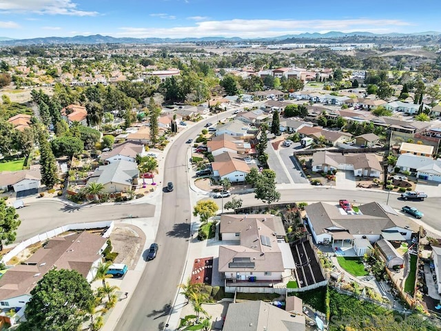 birds eye view of property with a mountain view