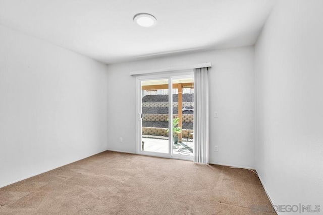 empty room featuring light colored carpet