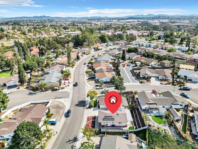 birds eye view of property featuring a mountain view