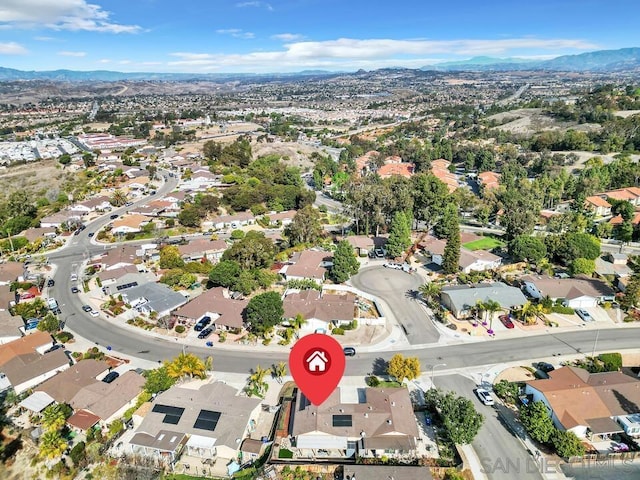 birds eye view of property with a mountain view