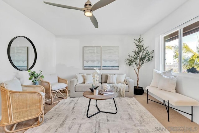 carpeted living room featuring ceiling fan