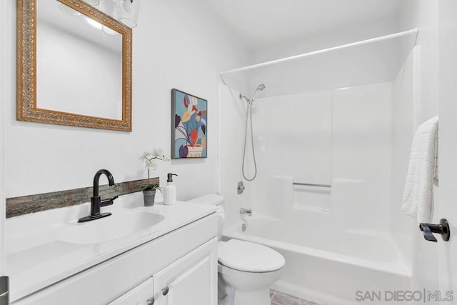 full bathroom with vanity, washtub / shower combination, and toilet