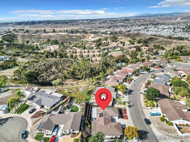 birds eye view of property with a mountain view