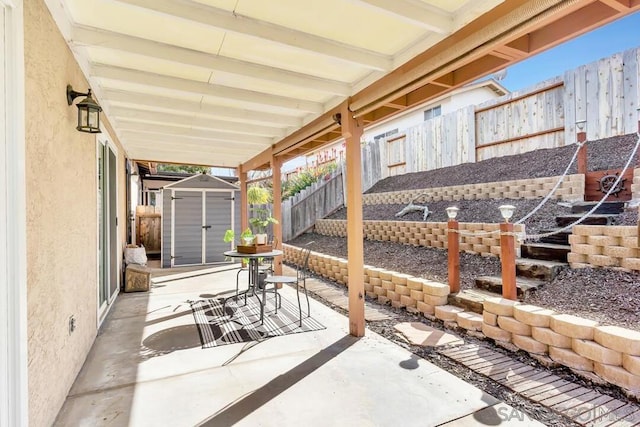 view of patio with a storage shed