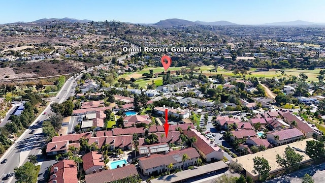 birds eye view of property featuring a mountain view