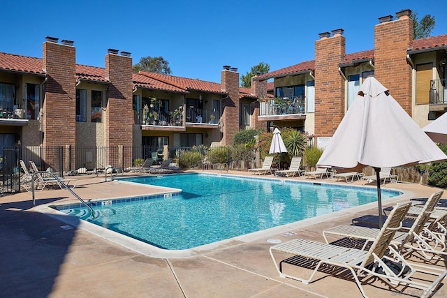 view of swimming pool featuring a patio area