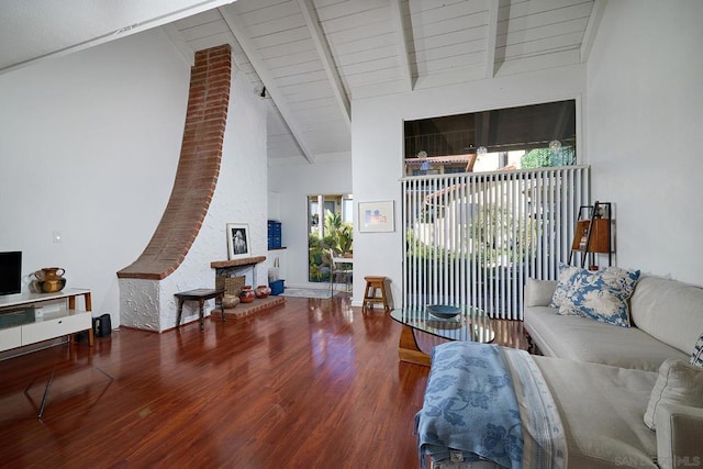 living room with wood ceiling, wood-type flooring, and lofted ceiling with beams