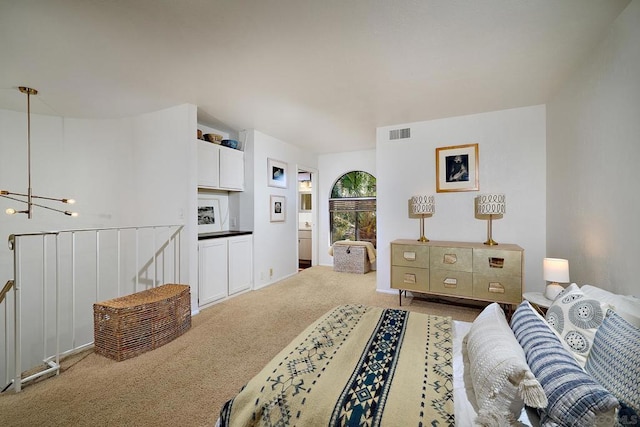 living room with carpet floors and a notable chandelier