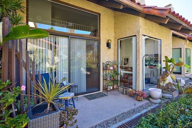 property entrance with a patio