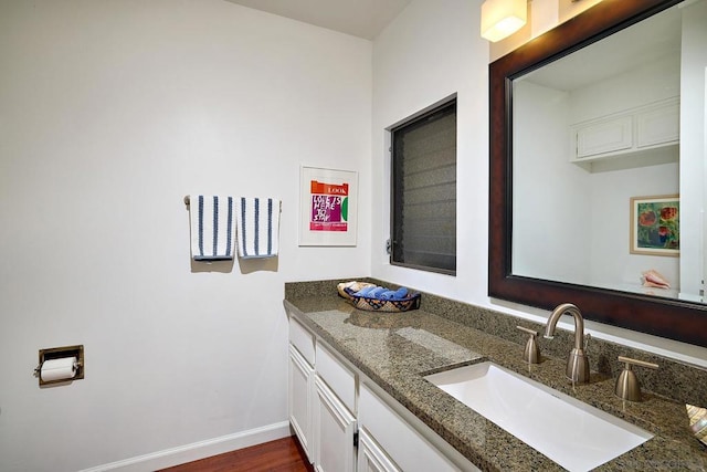 bathroom featuring hardwood / wood-style flooring and vanity