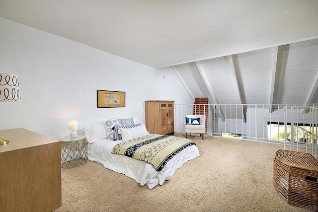 bedroom with vaulted ceiling and carpet flooring