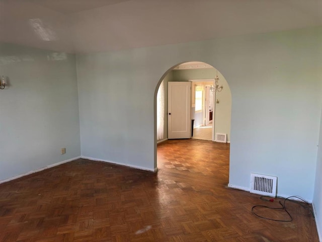 empty room with dark parquet floors