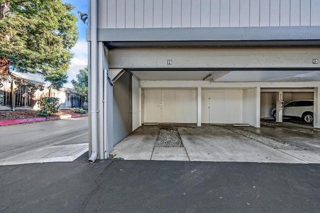 garage featuring a carport