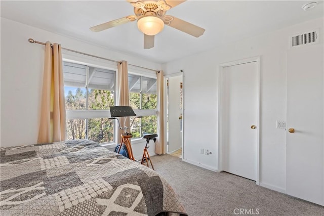 bedroom with light colored carpet and ceiling fan