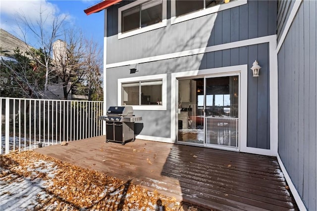 wooden deck featuring area for grilling