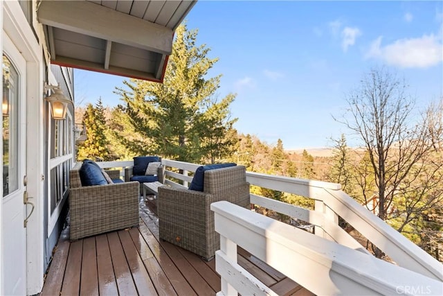 wooden deck with an outdoor hangout area