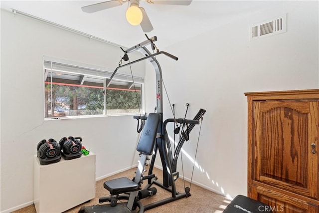 workout area with light colored carpet and ceiling fan