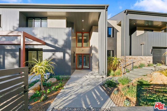 entrance to property featuring french doors